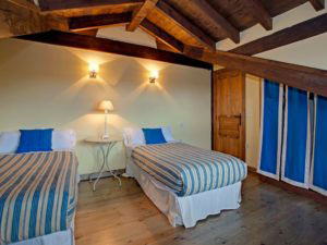 Schlafzimmer in Ferienhaus für 10 Personen